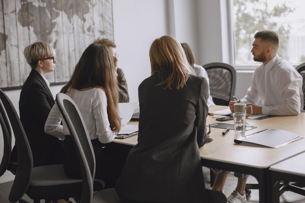 Colleagues in a productive meeting at a modern office, fostering teamwork and collaboration.